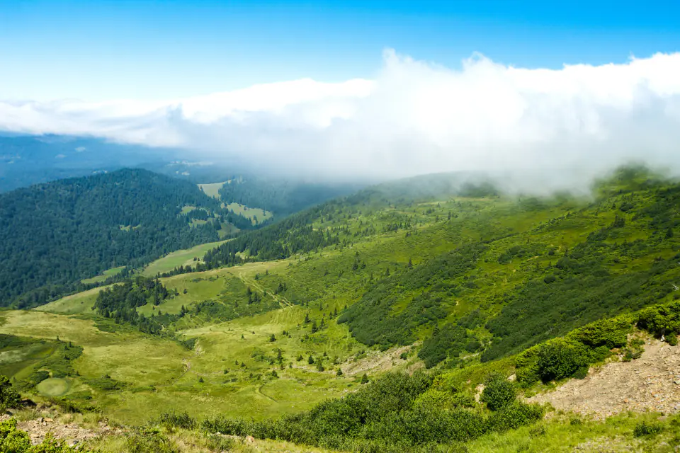 Green valleys and cloud-topped hills near Khyarkuli