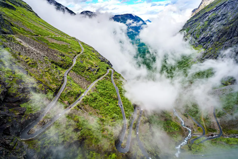 Clouds drifting through a steep green valley near Khyarkuli