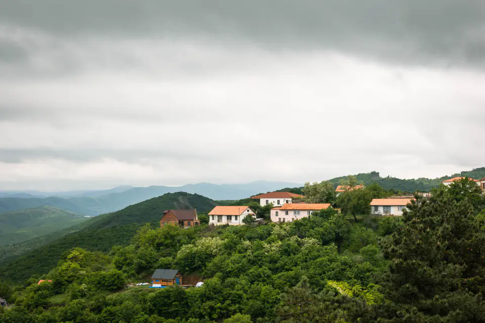 Hillside homes among trees at Khyarkuli, Mussoorie